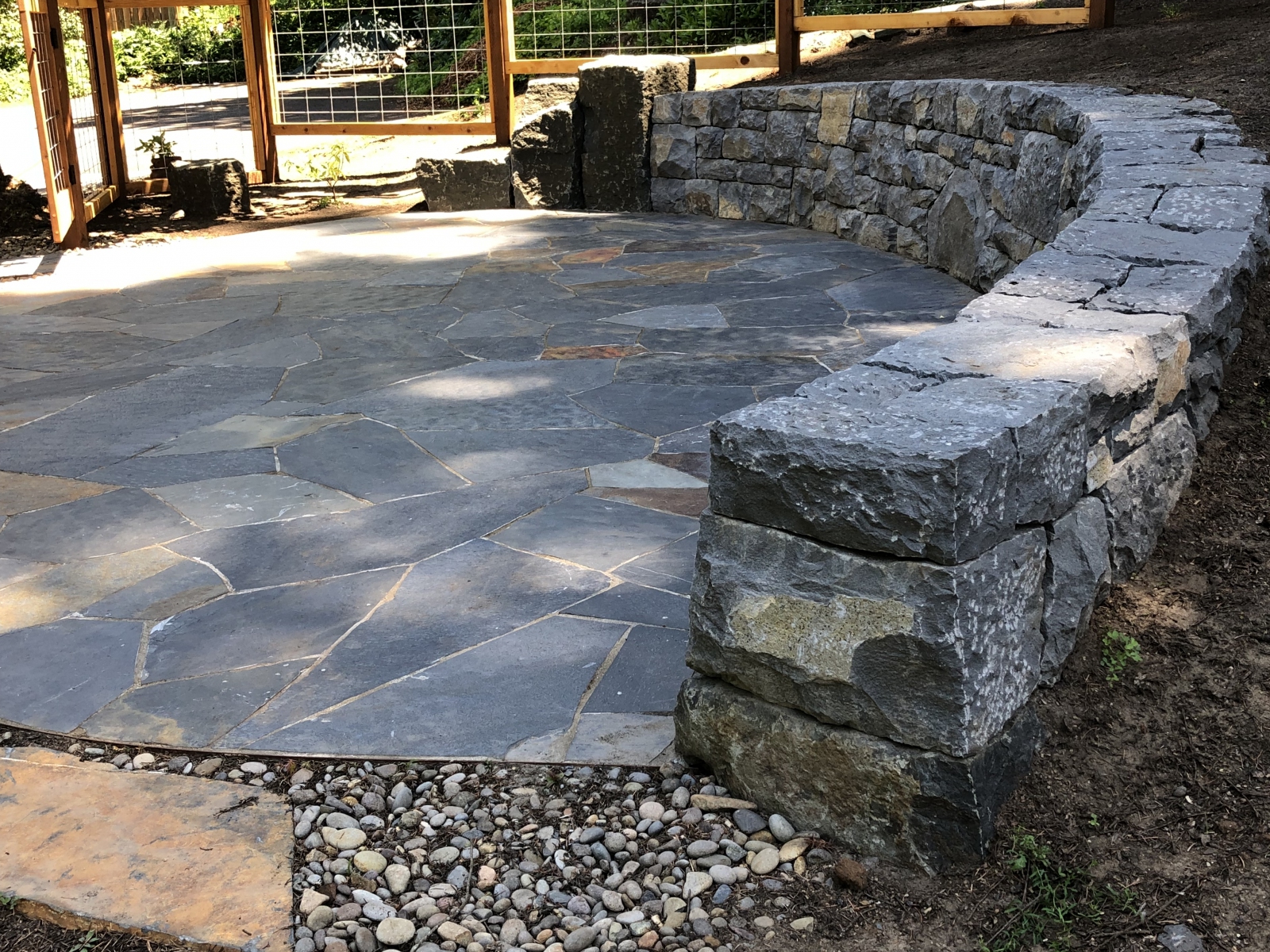 Oval patio and wall end.