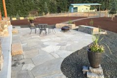 Sandstone patio, basalt seating walls