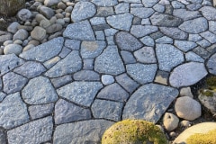 Basalt patio, river boulder edge