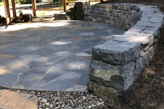 Oval patio and wall end.