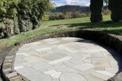 Bluestone patio, basalt retaining wall and step edge