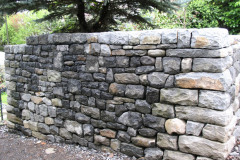 6' freestanding wall.  Dry stone construction. Solid cap.